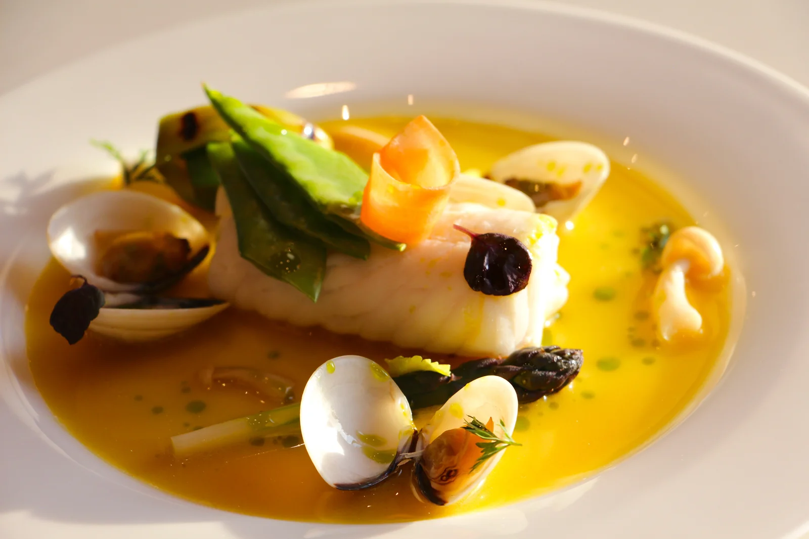 Fish with saffron broth, plated for private dining — God Save The Chef